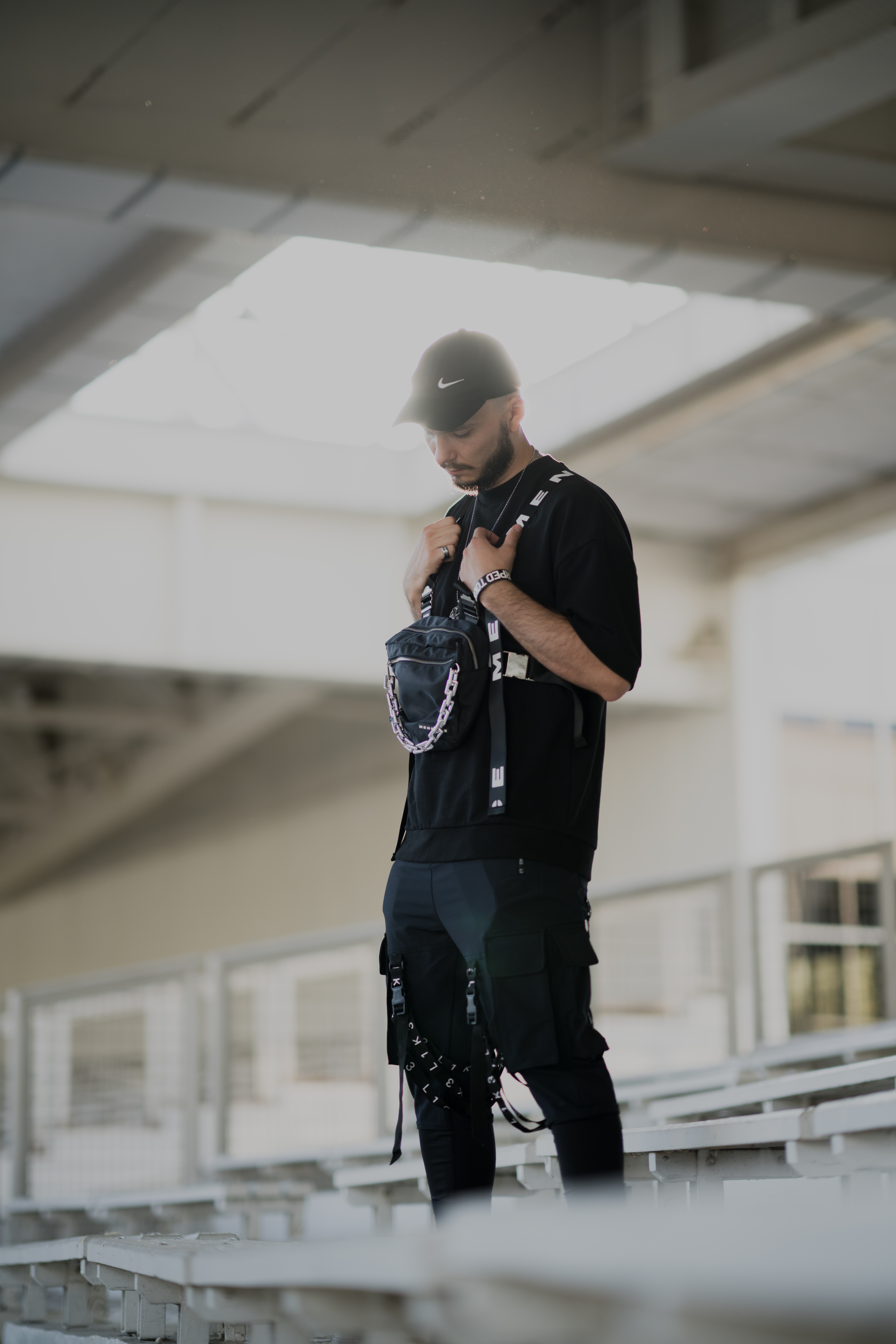 Portrait on bleachers in techwear