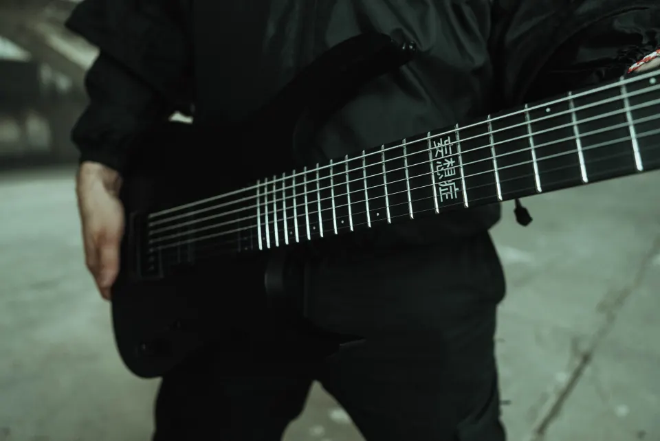 Close-up of a guitar fretboard