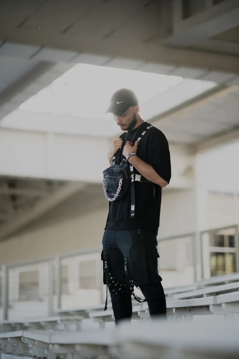 Portrait on bleachers in techwear